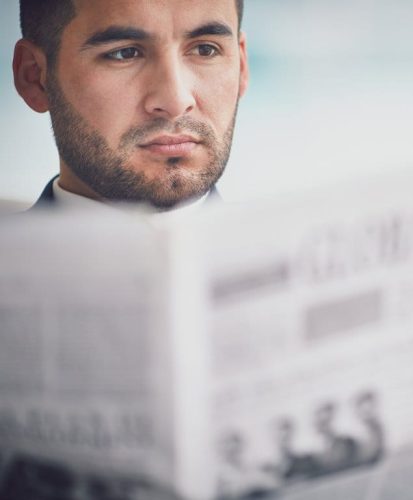 man reading newspaper