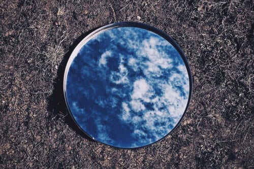 Reflection of the sky in a mirror on the ground