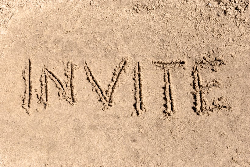 INVITE written in the sand
