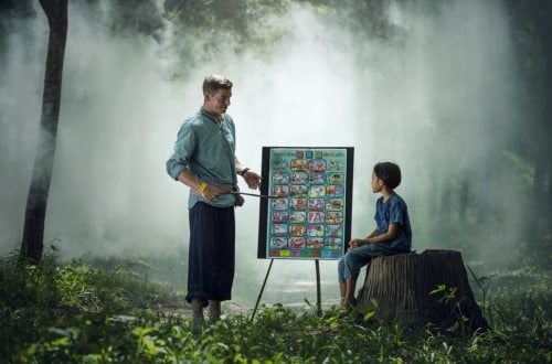 Teaching One-on-one teacher in a misty forest setting 