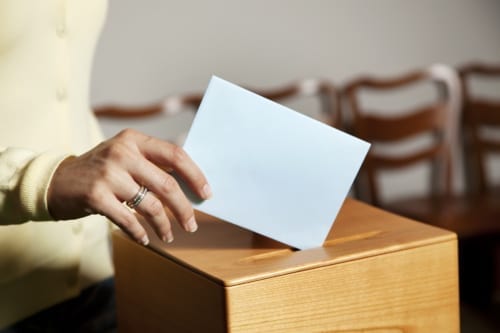 voter box and hand