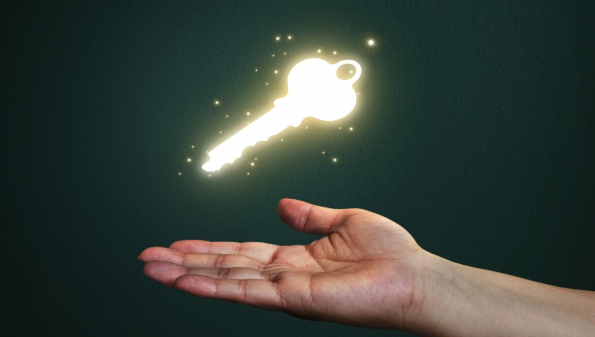 hand and glowing key