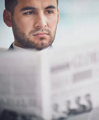 man reading newspaper