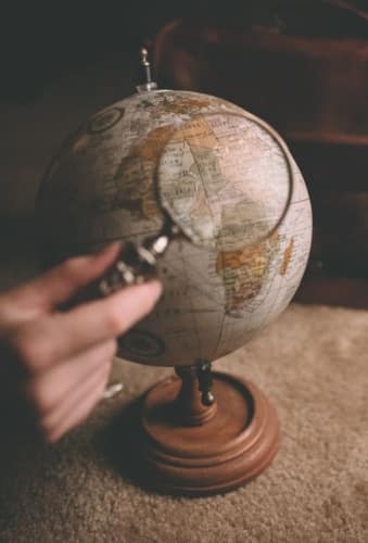 magnifying glass and globe