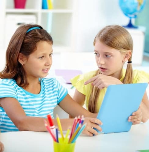 two girls with a tablet