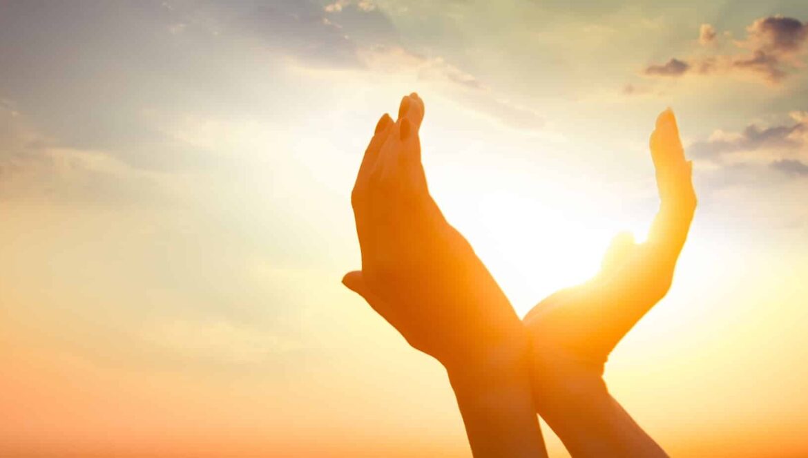 hands holding sun