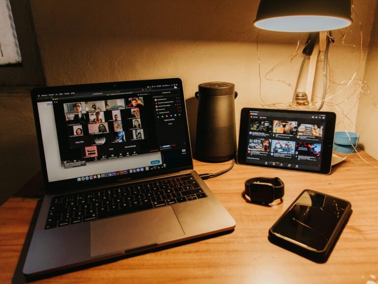 Black and silver laptop computer on brown wooden table