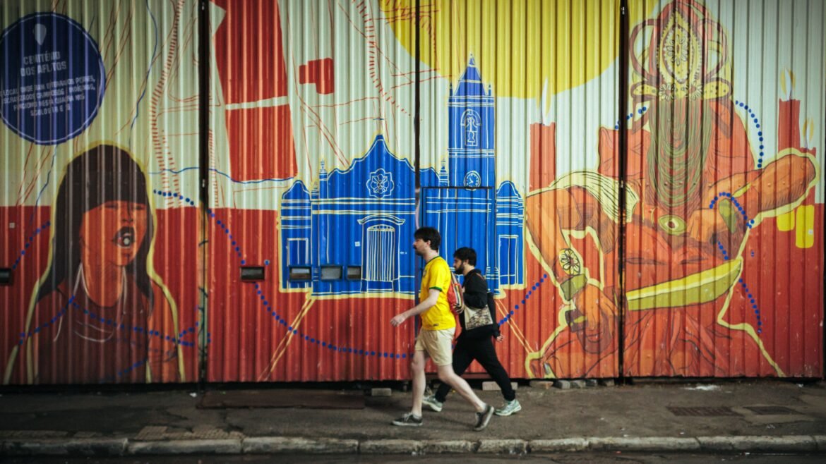 Colorful street art mural with people walking in São Paulo, Brazil, de