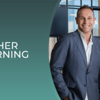 Two business professionals a man and a woman stand smiling in an office setting next to the CYHER LEARNING logo on a teal background
