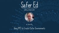 A presentation slide titled Safer Ed: making schools safer features a photo of Dr. Ken Roy. The subtitle reads “Using PPE to Create Safer Environments” on a blue background with abstract dotted patterns.