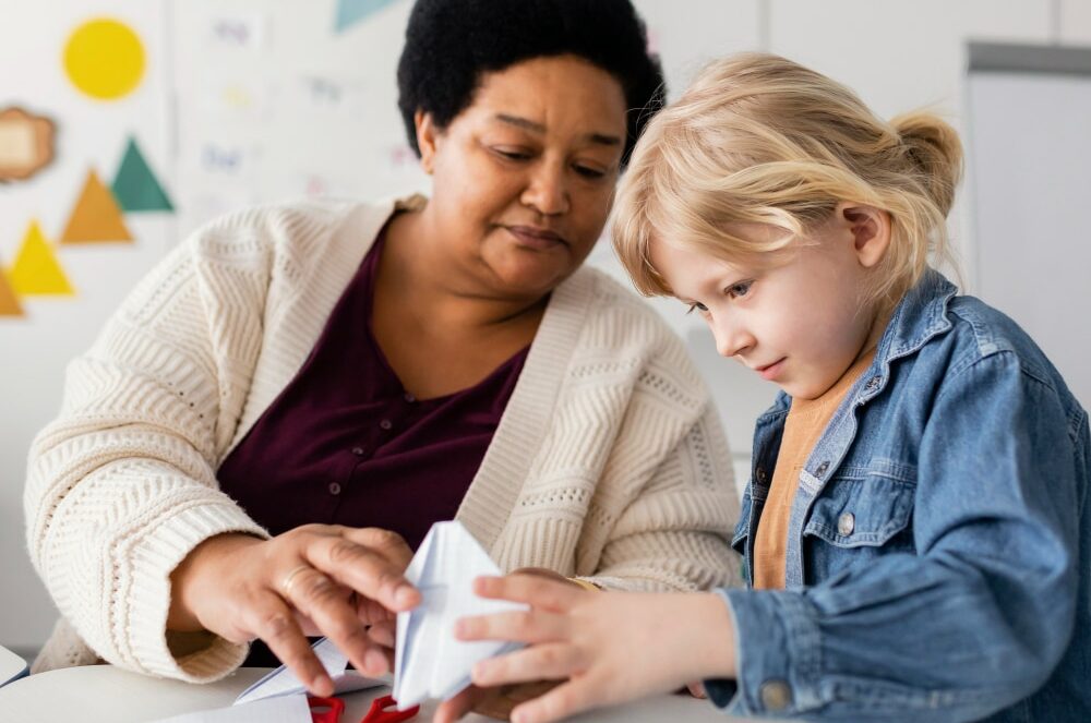 teacher working with one student