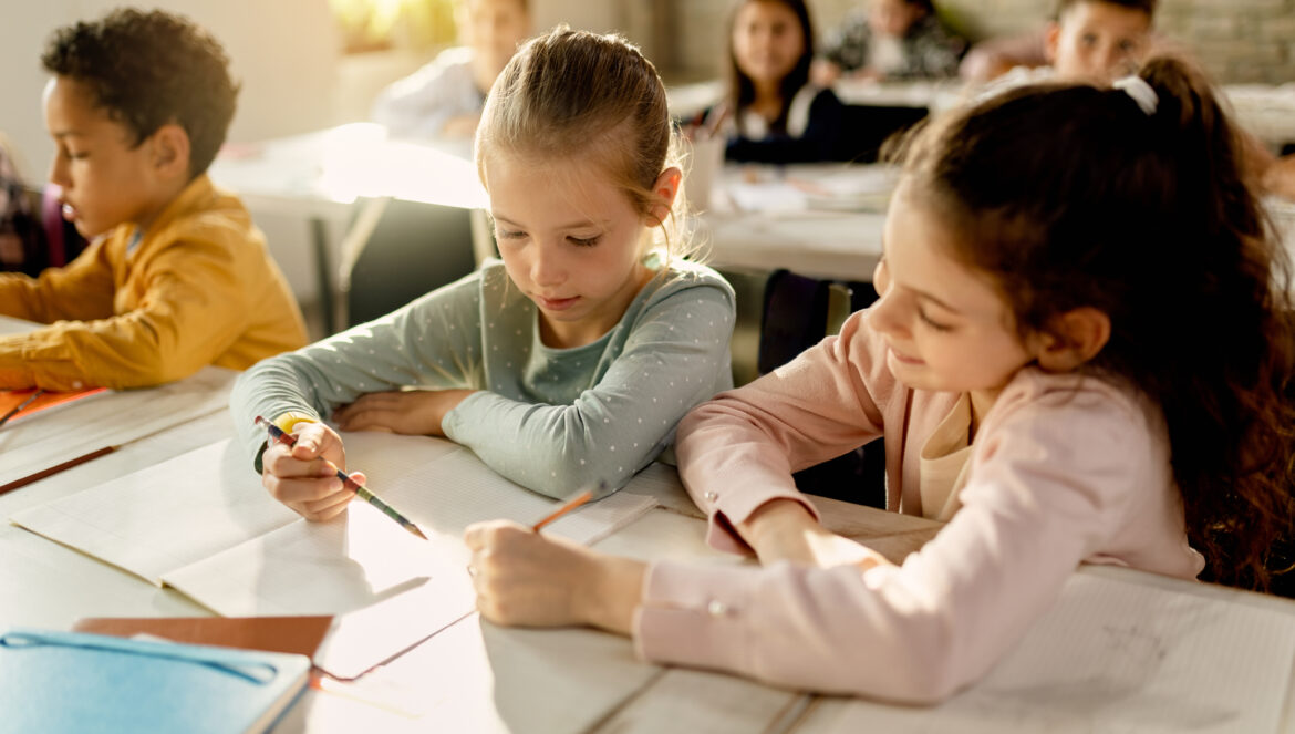 2 girls working together in classroom