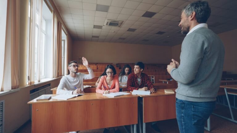Teacher interacting with students in a classroom setting
