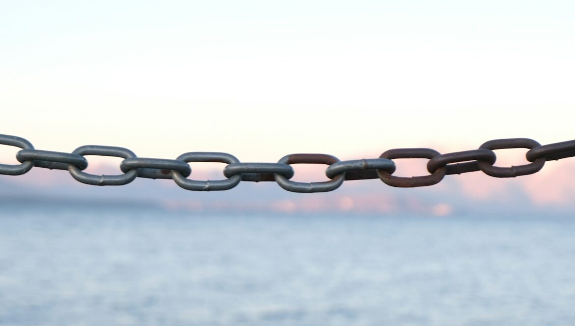 brown metal chain with white background