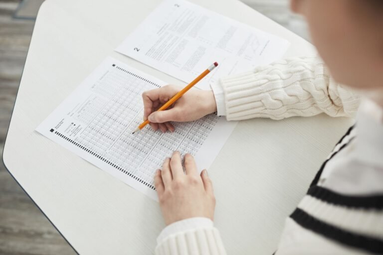 Close-up of a student filling out a multiple-choice exam in a quiet cl
