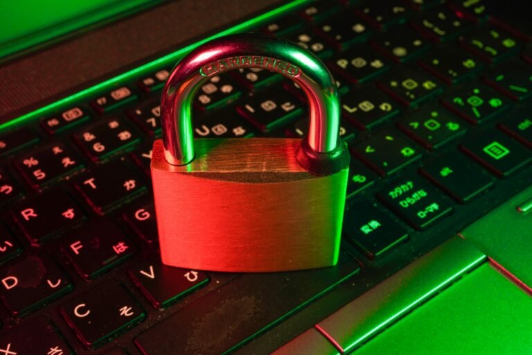 Red padlock on black computer keyboard