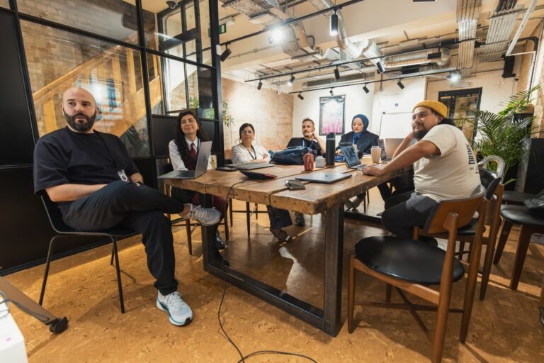 Diverse team engaged in a collaborative meeting in a contemporary offi