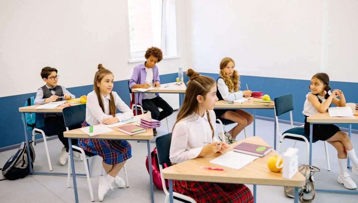 Students learning in a bright diverse classroom setting engaged and | edCircuit Students learning in a bright diverse classroom setting engaged and