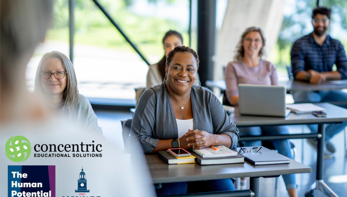 Smiling black woman at a table in a bright meeting room with other attendees in the background branding logos for concentric educational solutions and the human potential lab appear in the bottom left corner