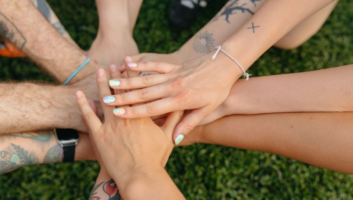 A group of peoples hands with tattoos and colorful nails symbolizing | edCircuit A group of peoples hands with tattoos and colorful nails symbolizing