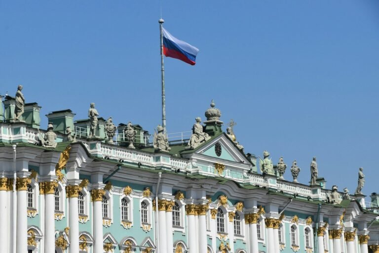 A large building with a flag on top of it