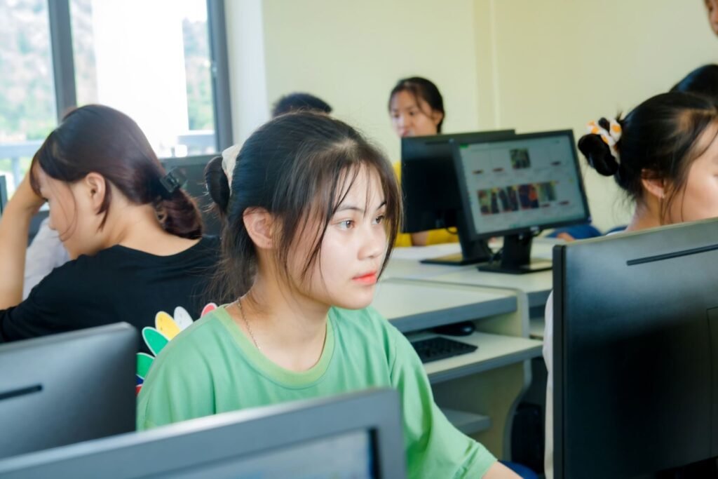 Asian students focused on studying technology in a bright computer cla | edCircuit Asian students focused on studying technology in a bright computer cla