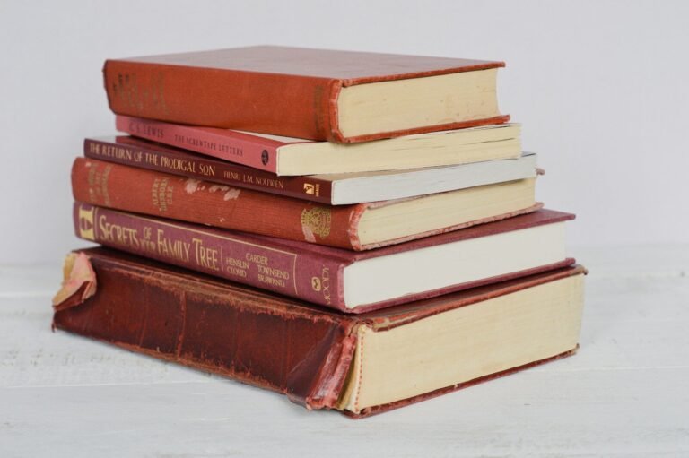 Brown hardbound books on white table