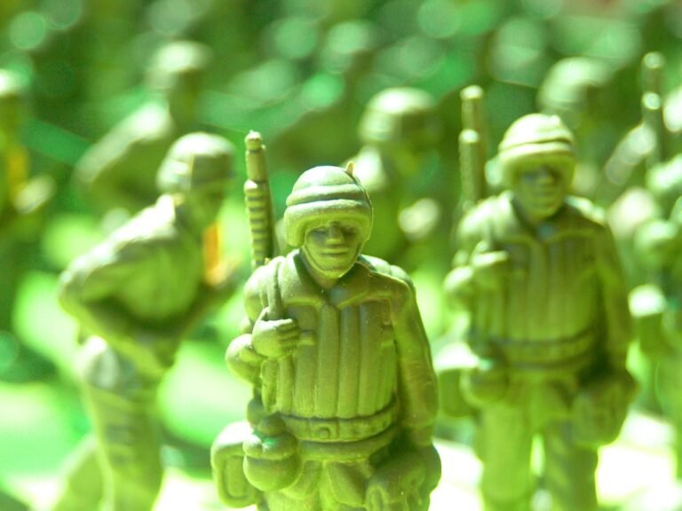 Detailed shot of green toy soldiers in uniform, ideal for military-themed projects