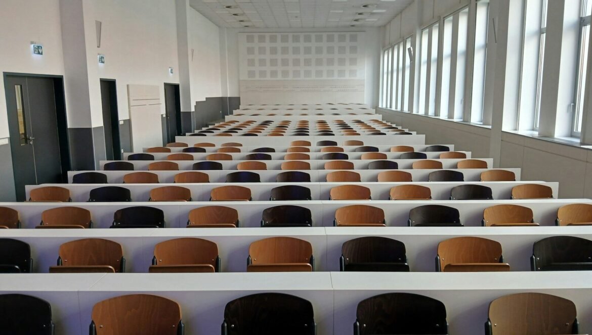Empty lecture hall with rows of seats