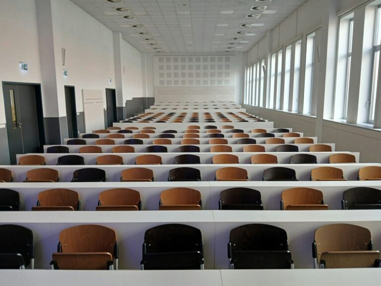 Empty lecture hall with rows of seats