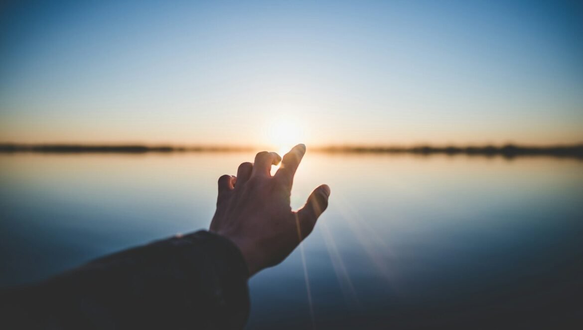 Landscape photography of persons hand in front of sun | edCircuit Landscape photography of persons hand in front of sun