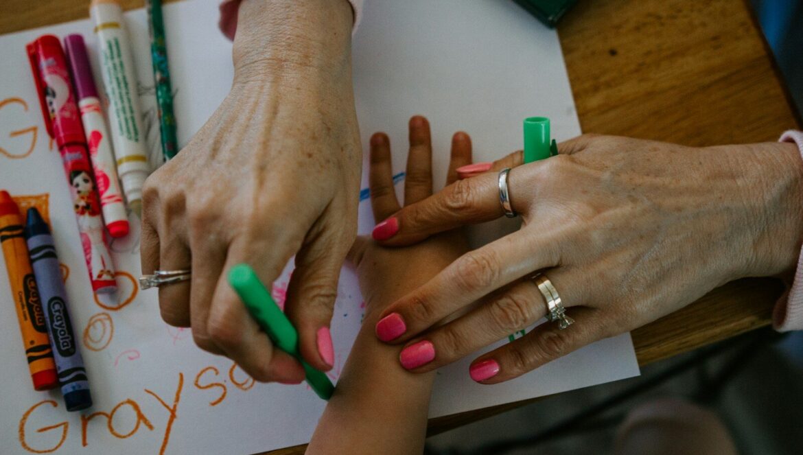 Person wearing silver ring and green manicure | edCircuit Person wearing silver ring and green manicure
