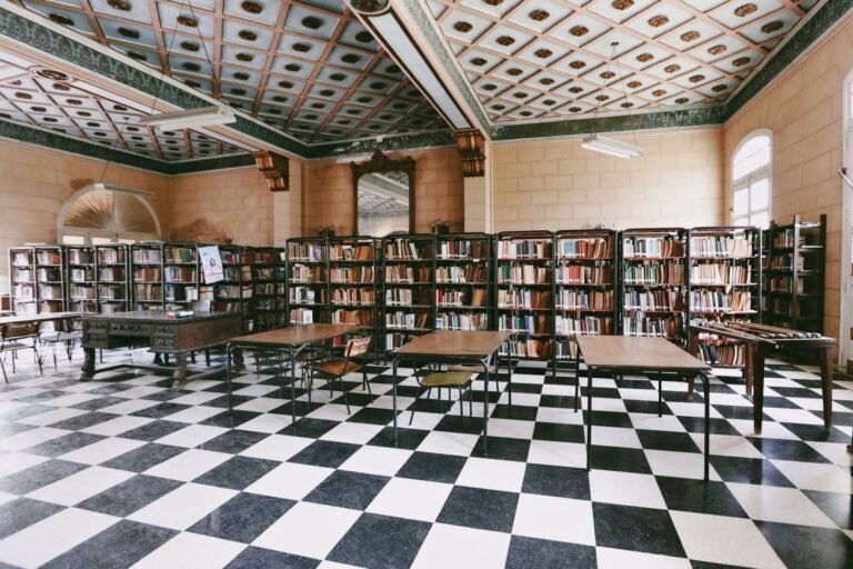 Spacious library interior with books, shelves, and tables. Ideal for study