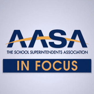 Logo for AASA, The School Superintendents Association, with a gold curved line through the acronym and the words IN FOCUS in bold gold letters on a blue background below.